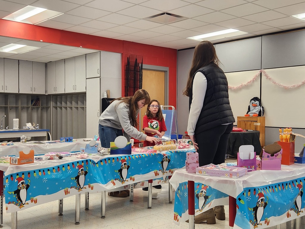 Students at the Penguin Patch - High school students with elementary students
