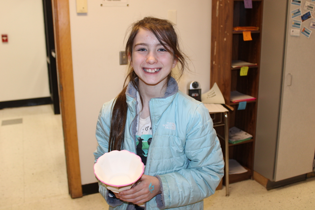 Student with painted ceramic