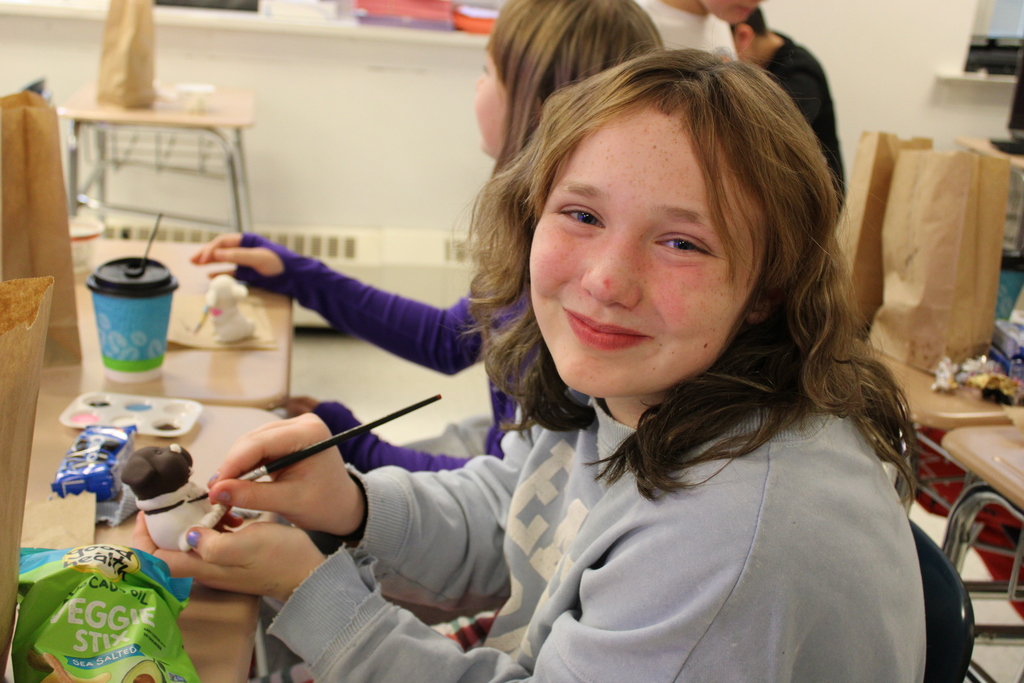 Student painting ceramic
