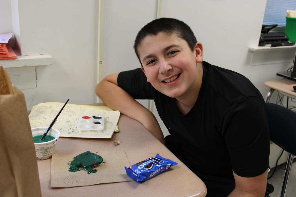 Student painting ceramic