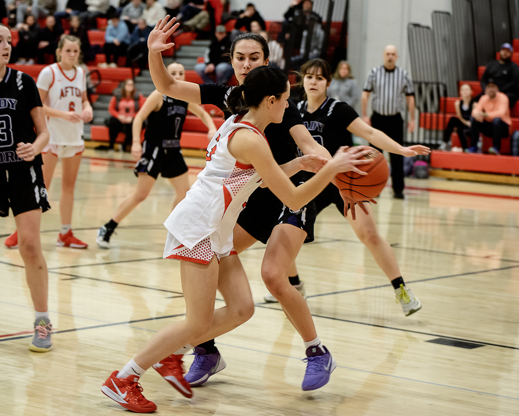 Afton Basketball player in action dribbling the ball