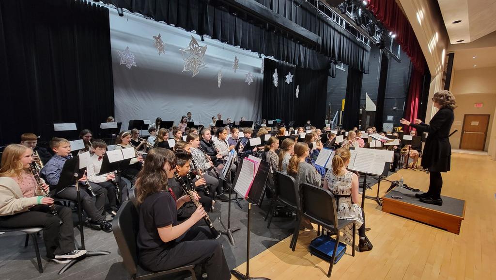 students in band performing in all county
