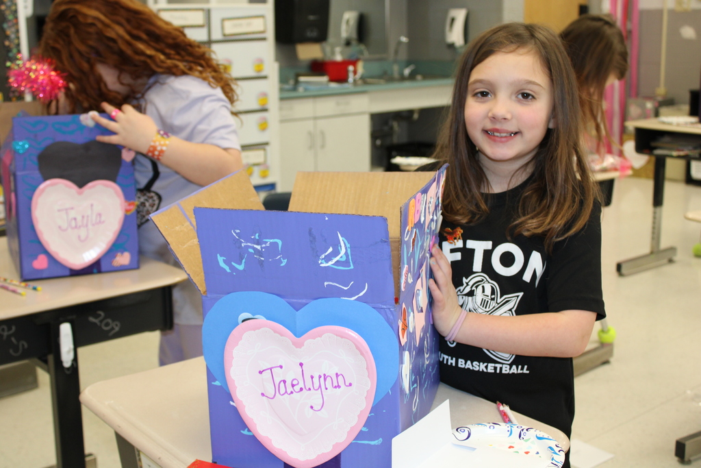 Afton student with box