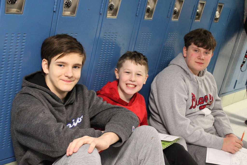 students smiling with books