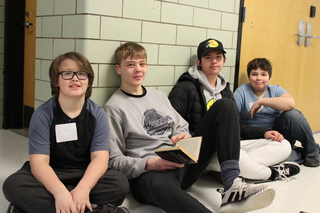 students smiling with books