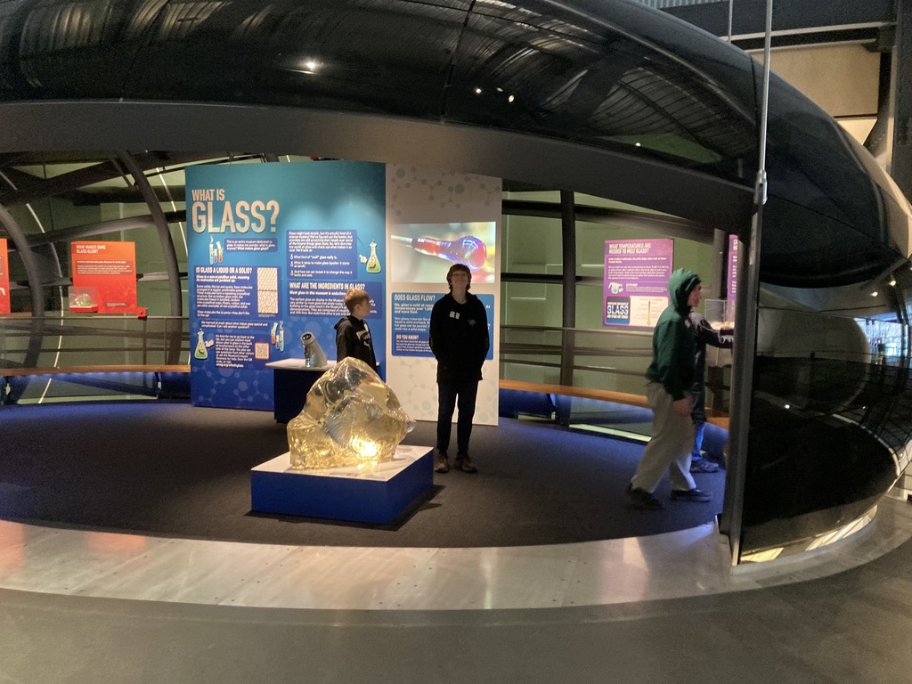 Students enjoying display learning about glass