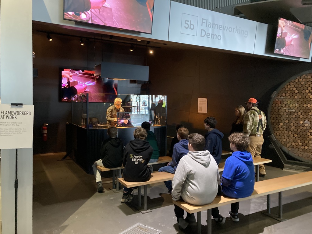 Students watching glass-making demo
