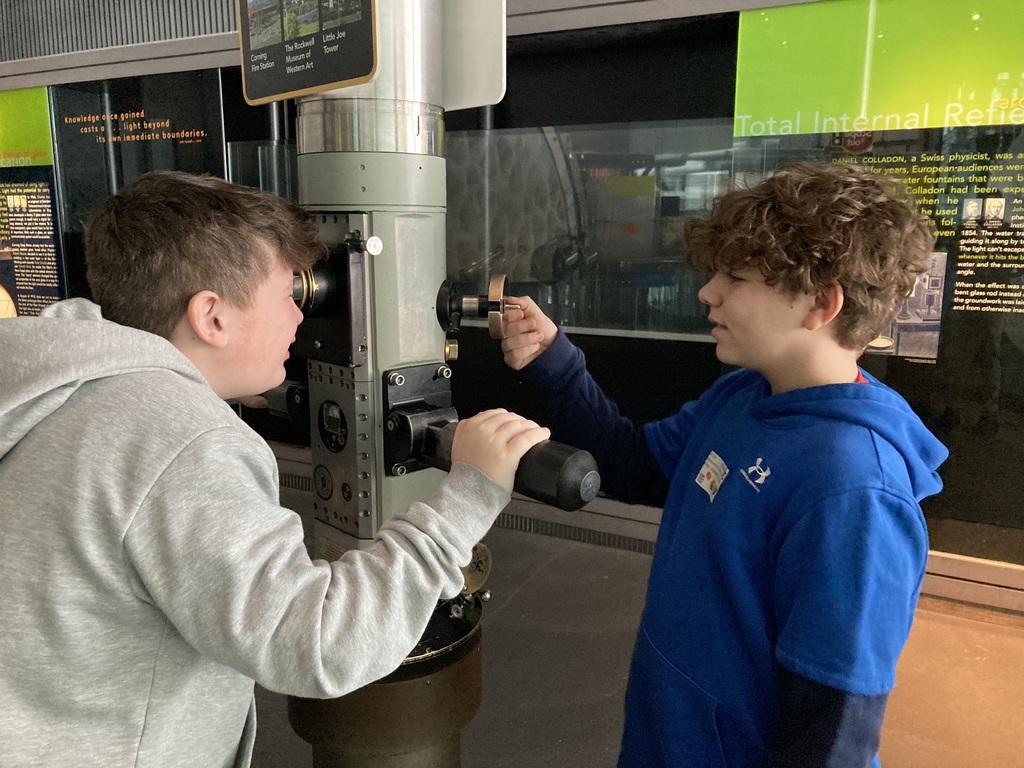 Students looking through periscope display