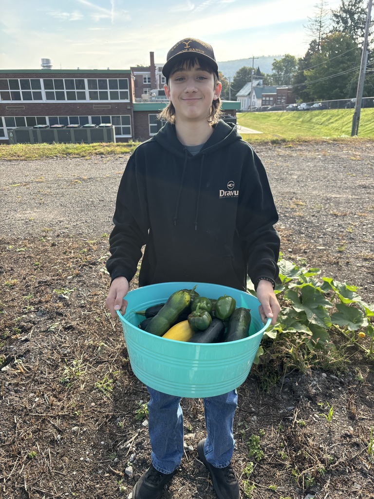 Student holding produce