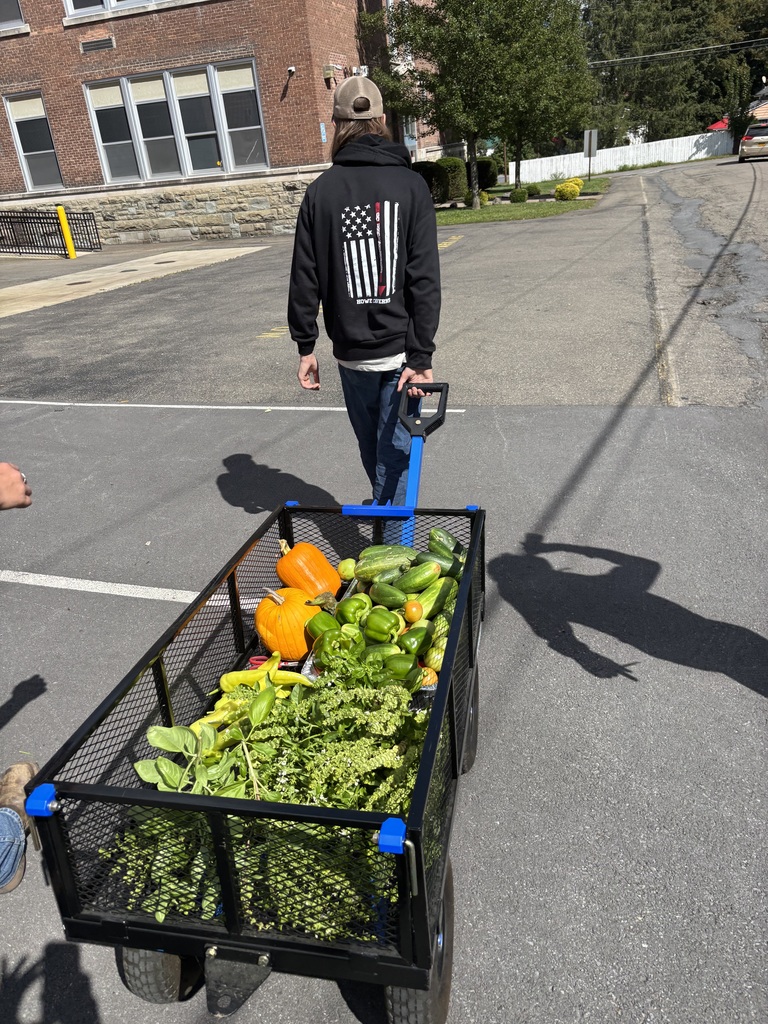 Student with produce cart