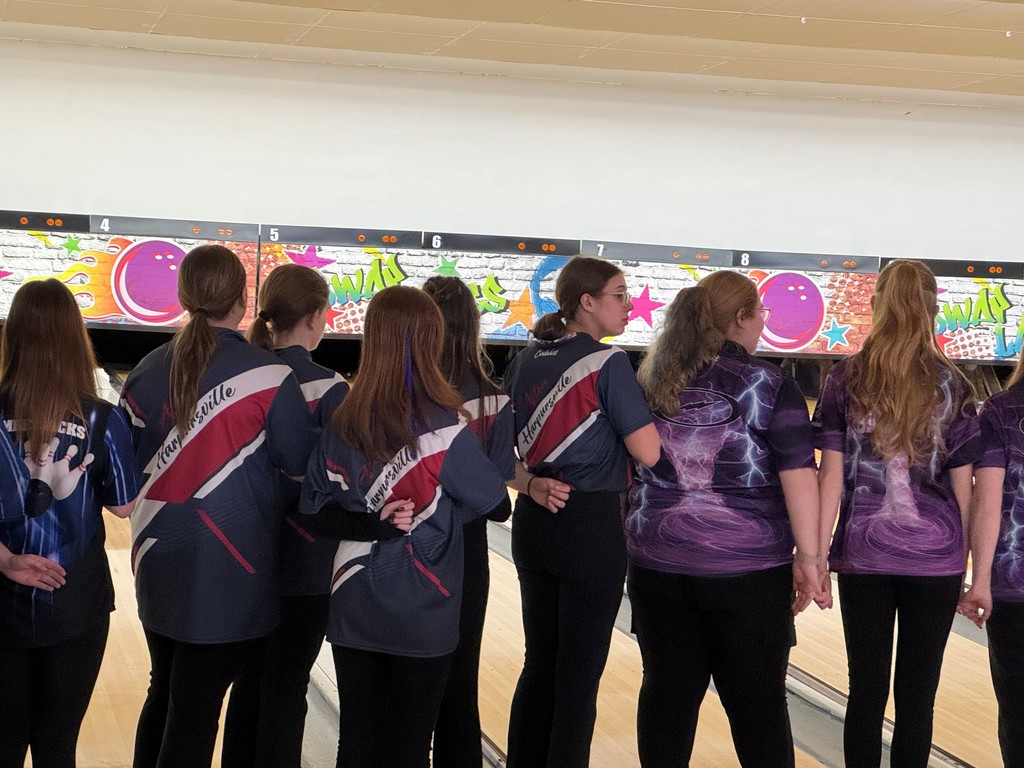 girl bowlers honoring the flag for the pledge of allegiance