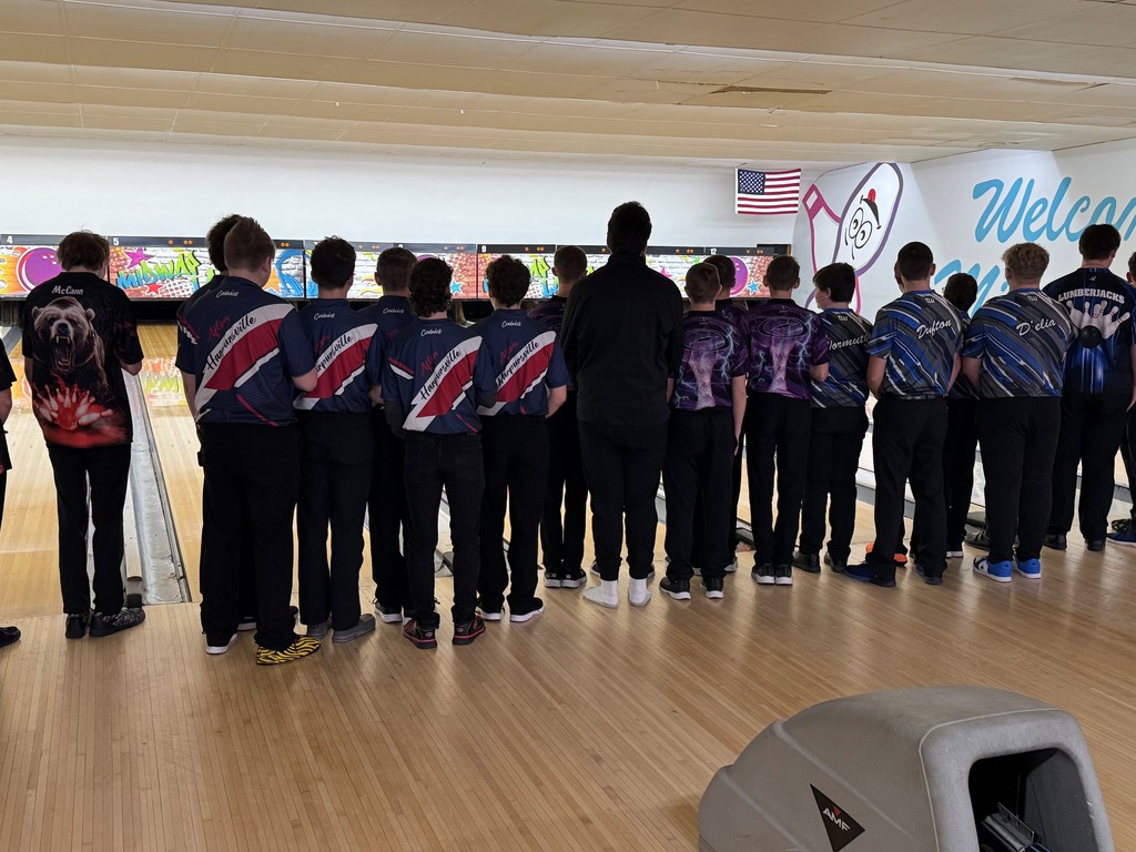 Boy bowlers honoring the flag for the pledge of allegiance