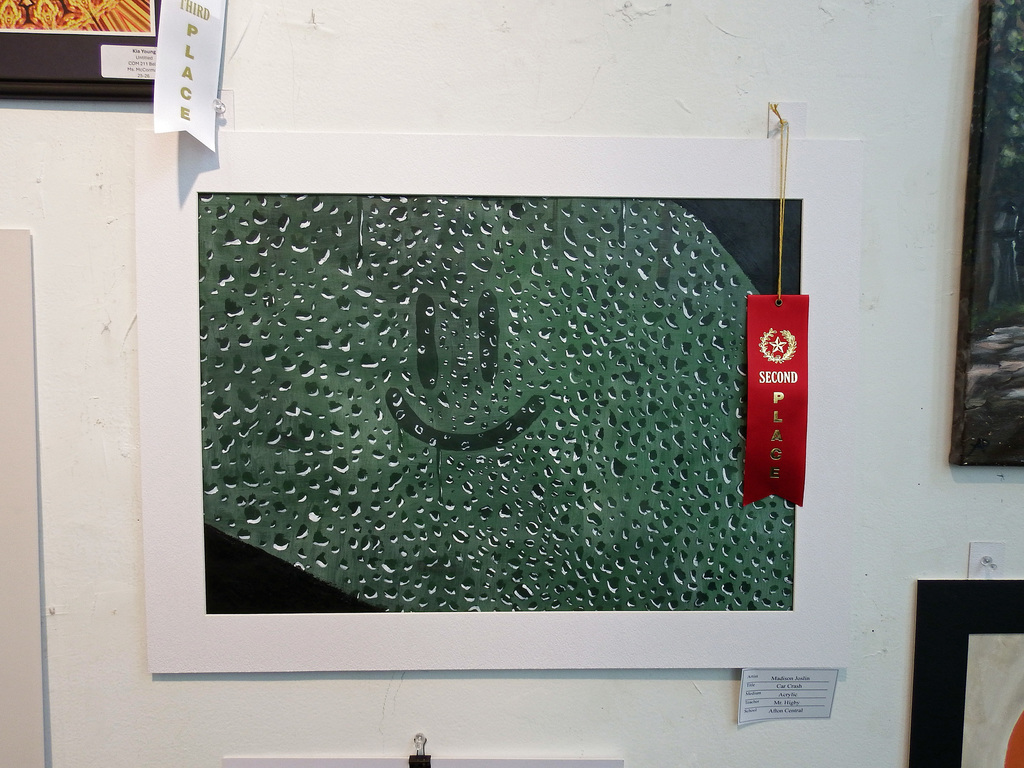 Madison Joslin Car Crash painting Smilie face drawn with finger on car window