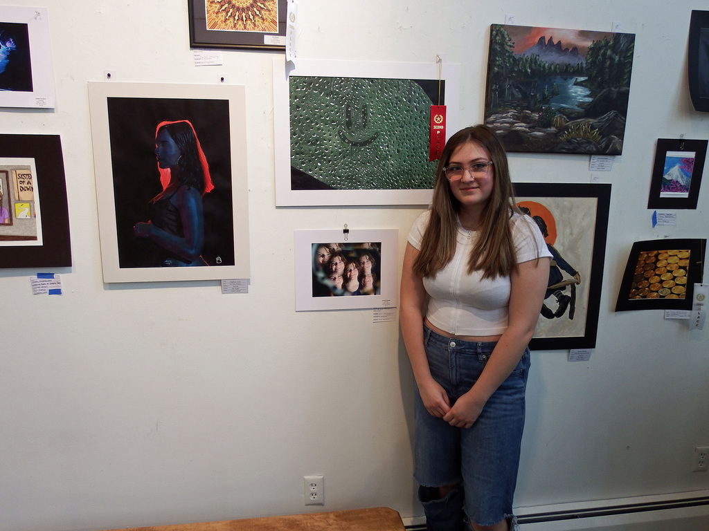 Madison Joslin with Car Crash Painting and other artwork in background