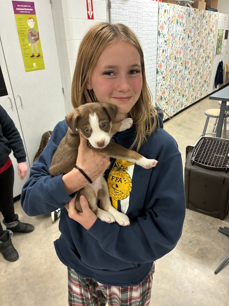 Student with puppy