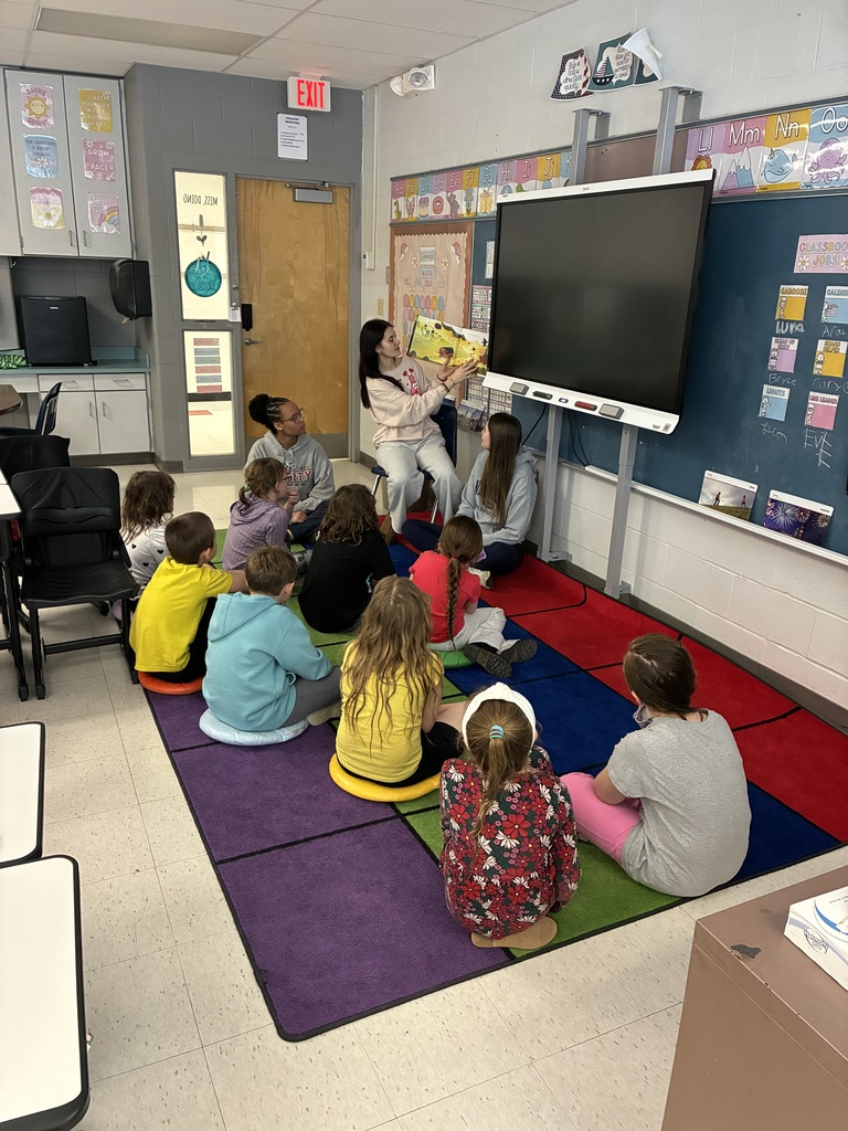 Afton high school students reading to elementary students