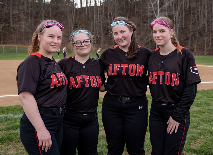 softball players smiling together
