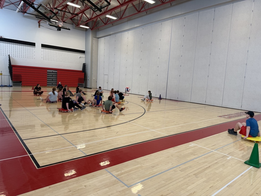 students playing scooter soccer