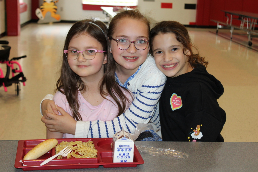 Afton students smiling with lunch food