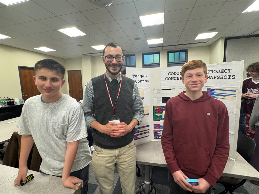 Afton STEP students with teacher and poster