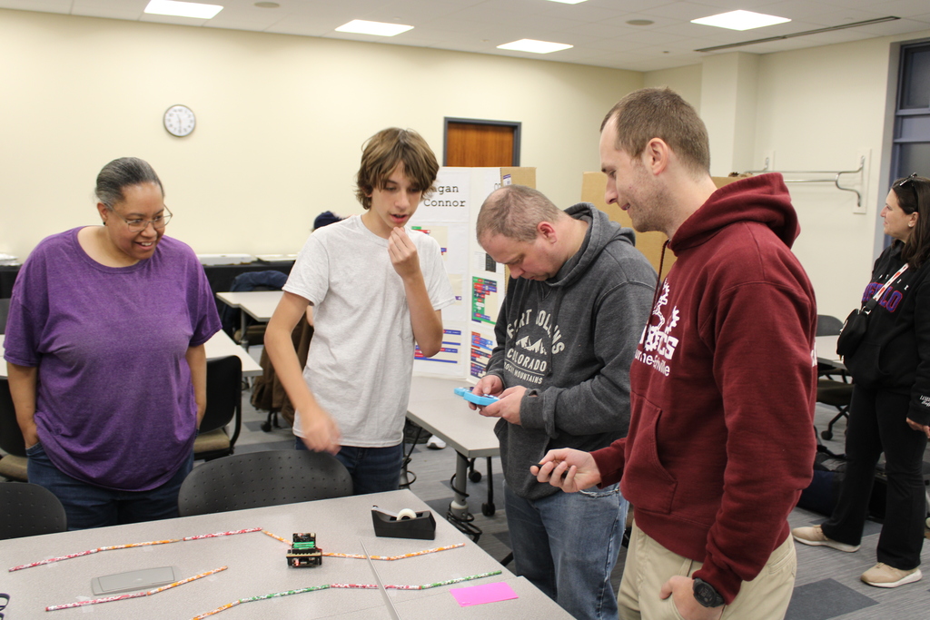 Student showing and discussing project