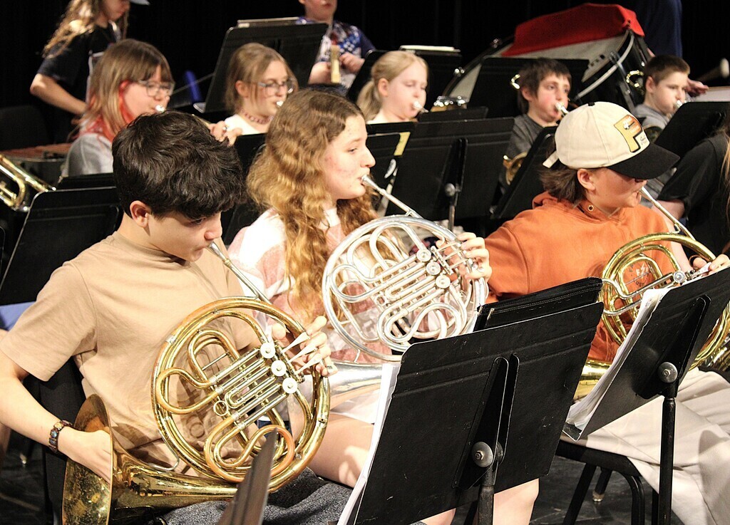 Students practicing with instruments