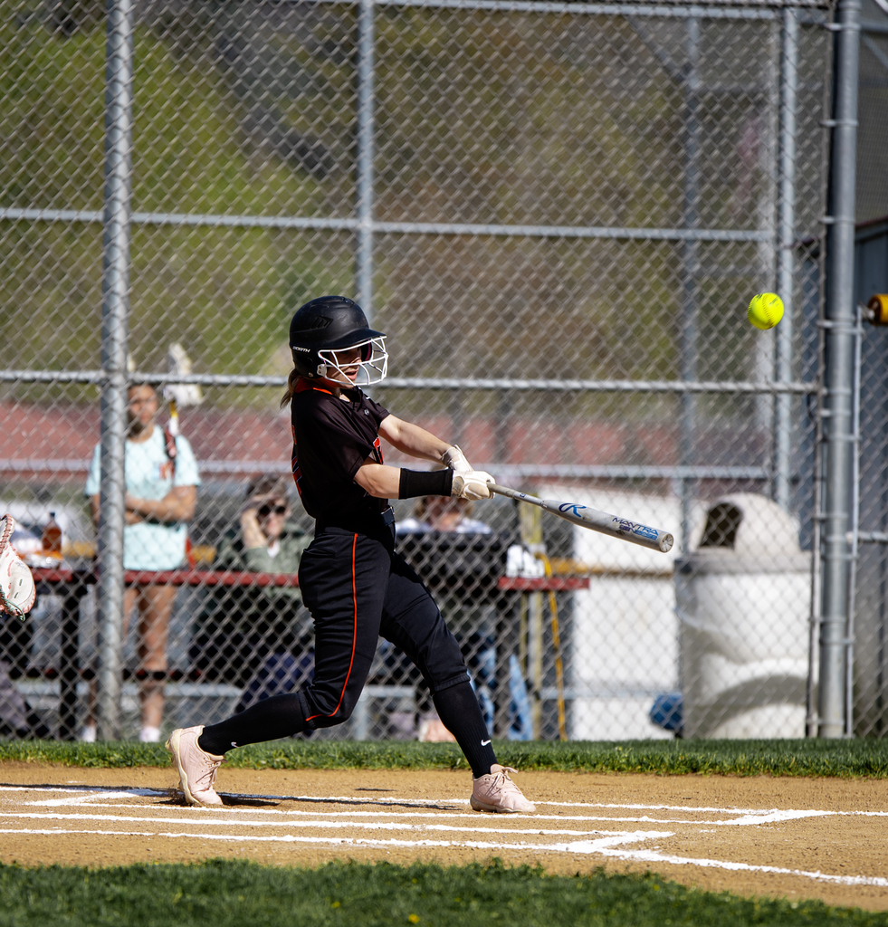 Softball player batting
