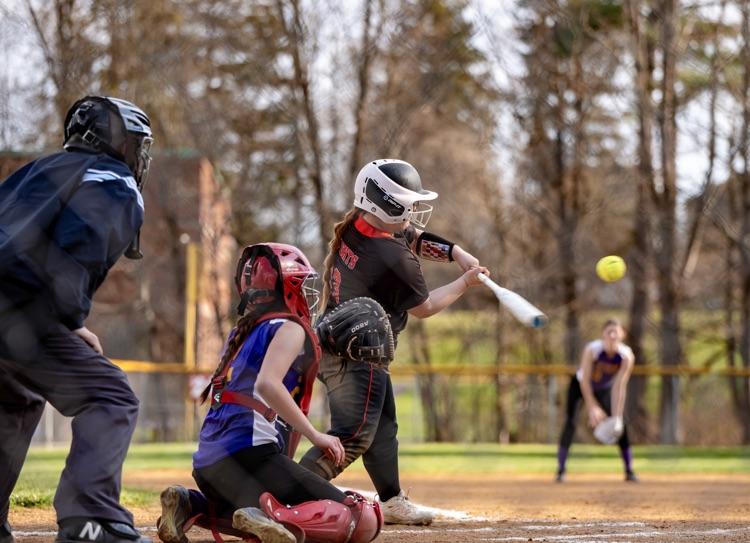 softball batter in action