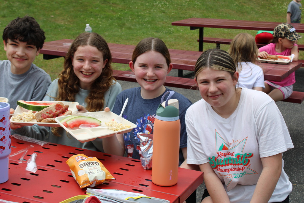 Students smiling at picnic