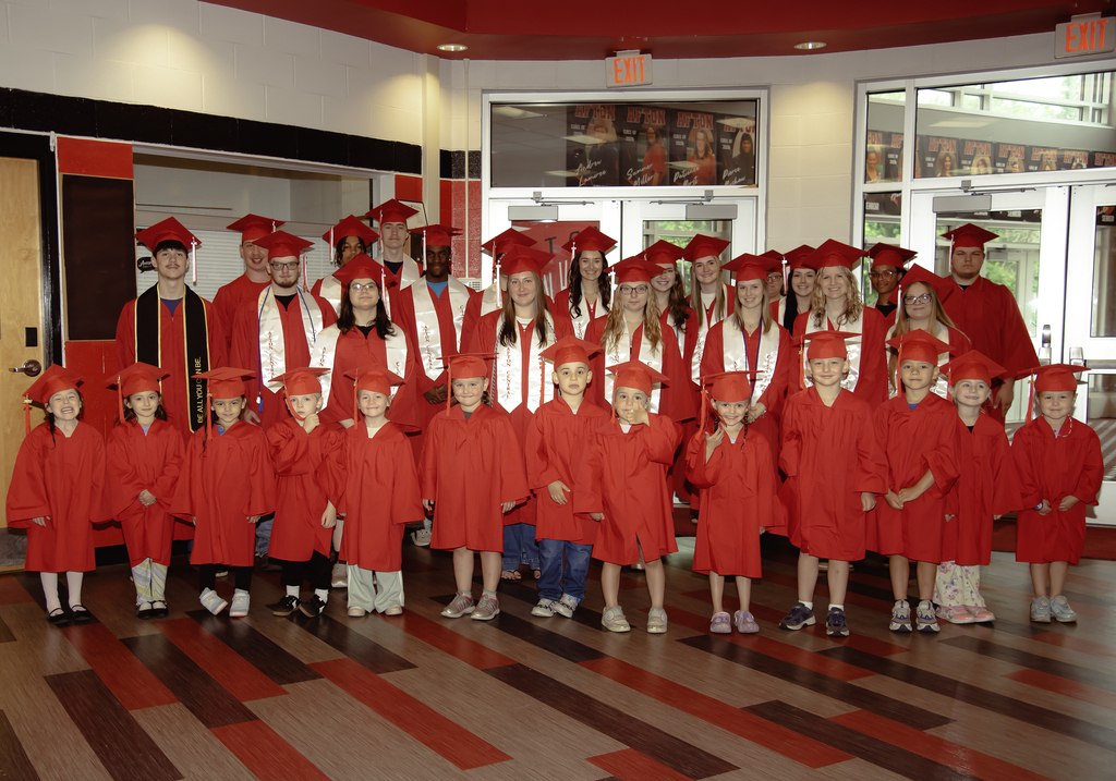 Seniors and pre-k students in hallway