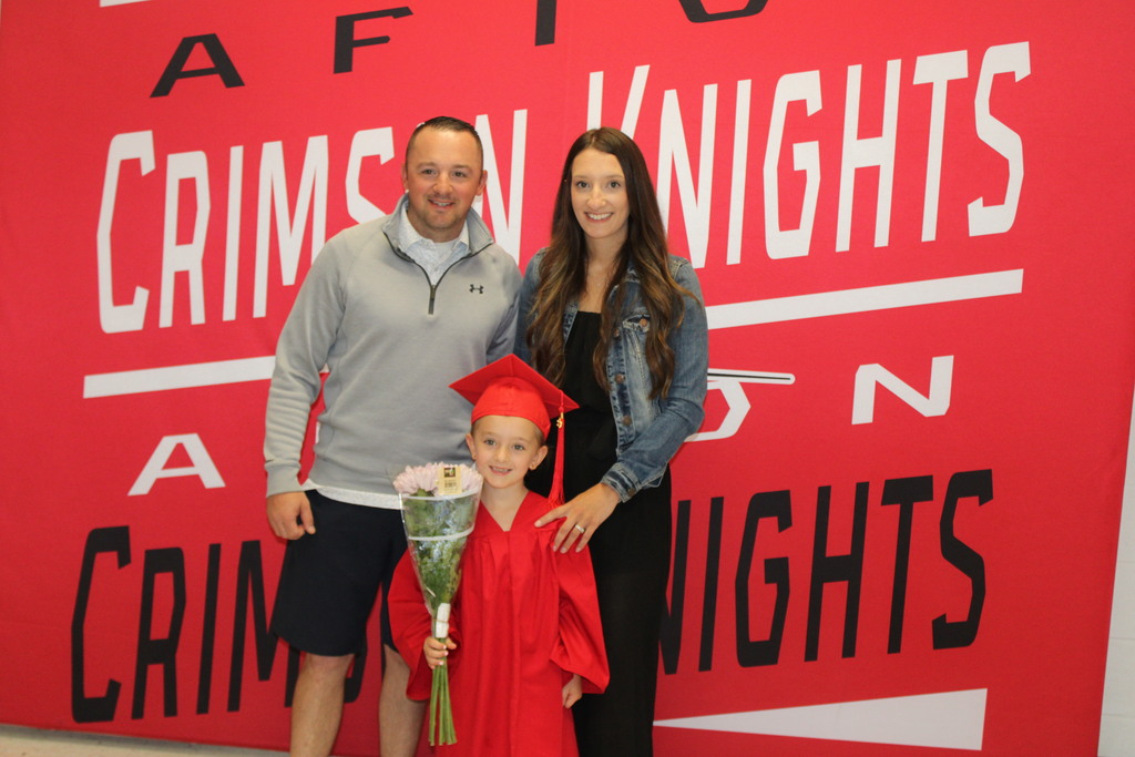 Afton Family in front of Crimson Knight Banner