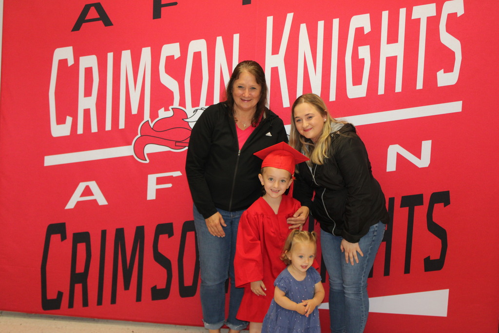 Afton Family in front of Crimson Knight Banner
