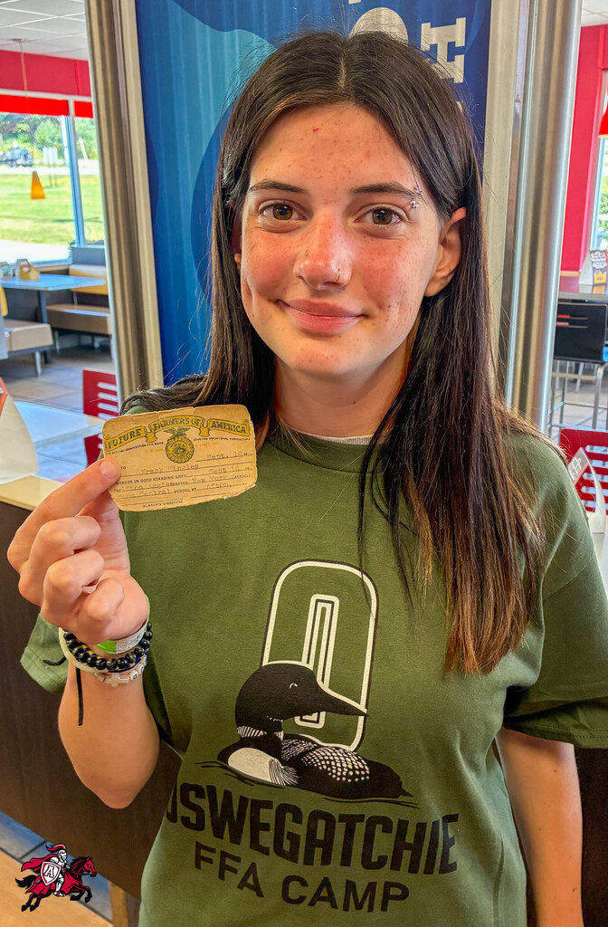 A female Afton FFA member poses for a photo at Camp Oswegatchie