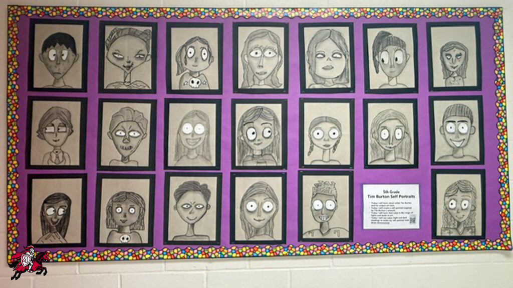 A bulletin board displays a collection of pencil drawings of faces, each in a black frame against a purple background.