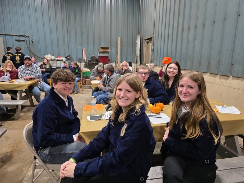 Students smiling at the meeting