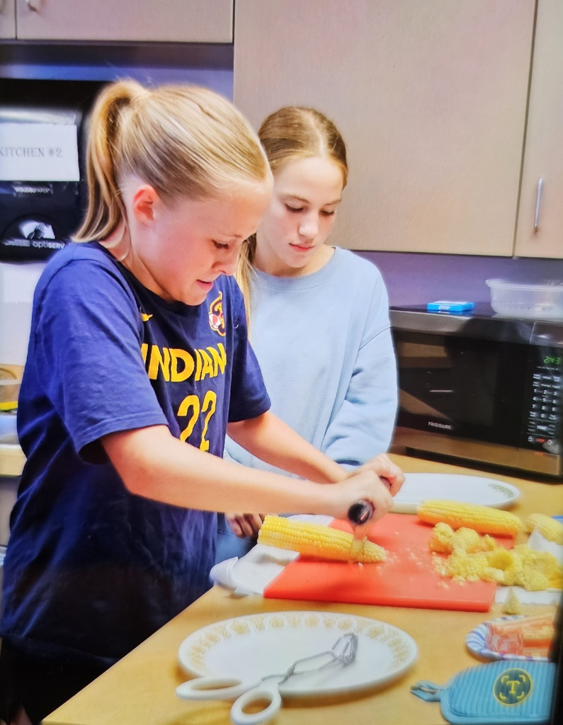 6th graders took their turn cutting the ends before cooking. 