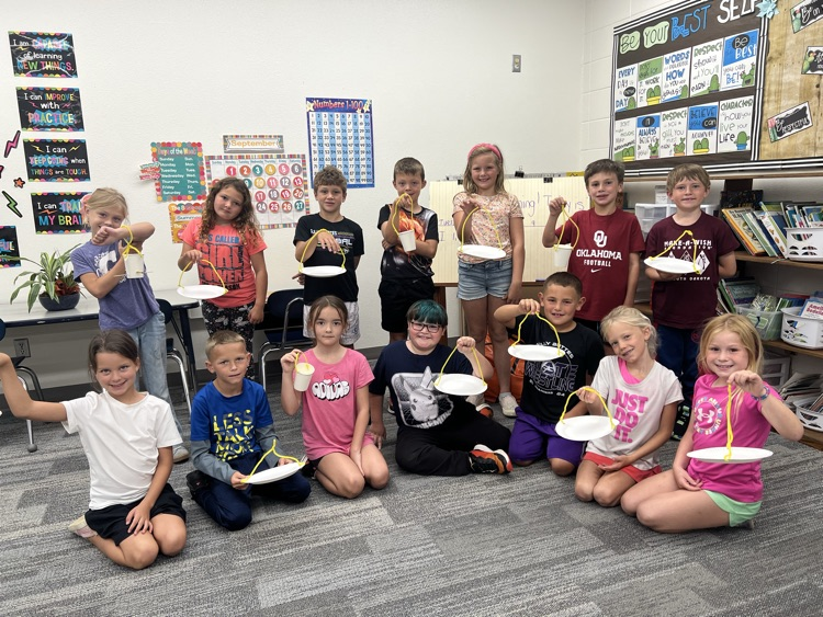 Second Grade designing bird feeders in science.