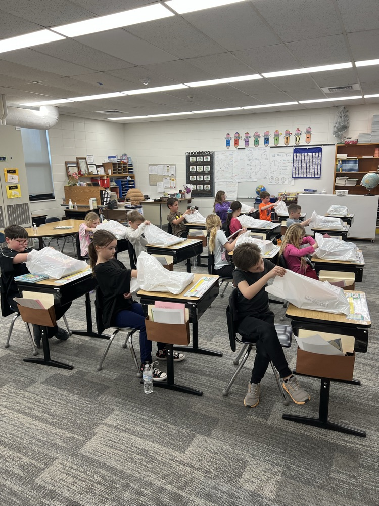 Second Graders opening their books!