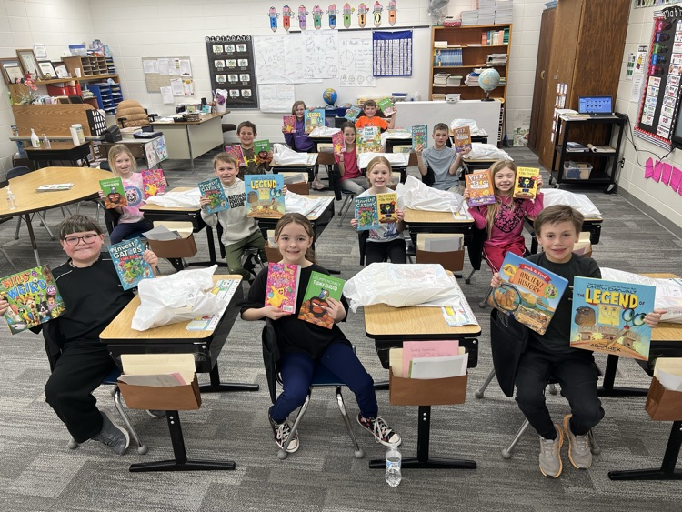 Second Graders happy to have a bag full of new books!