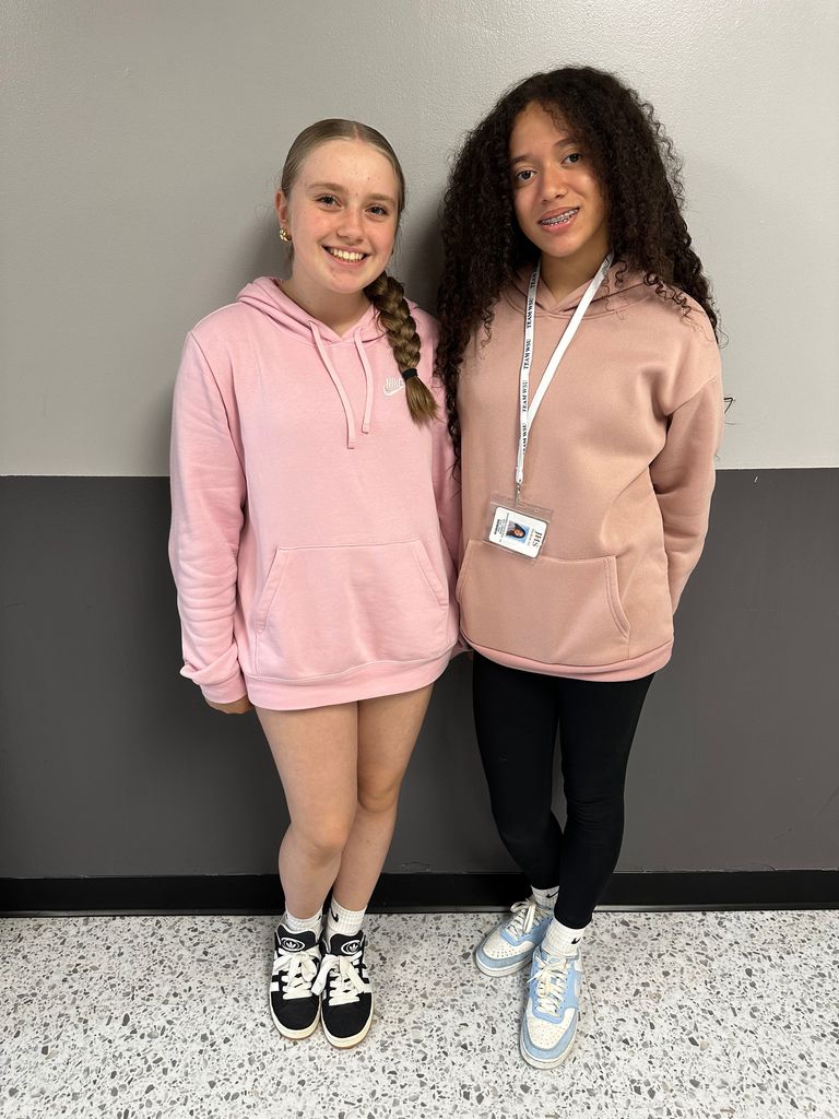 students wearing pink hoodies