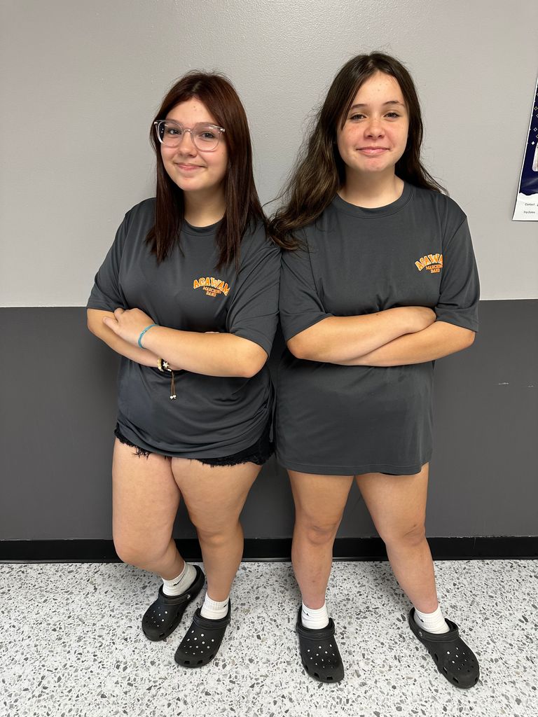 students dressed with black shorts and agawam swim tshirts