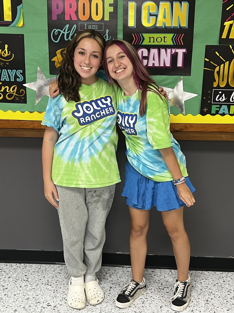 2 students wearing matching Jolly Rancher tees