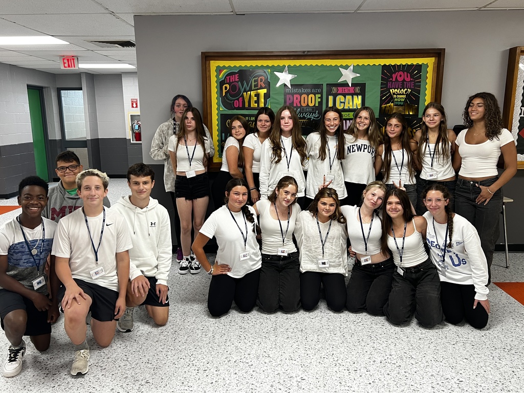 multiple twins 20 students all wearing white tshirts and black pants