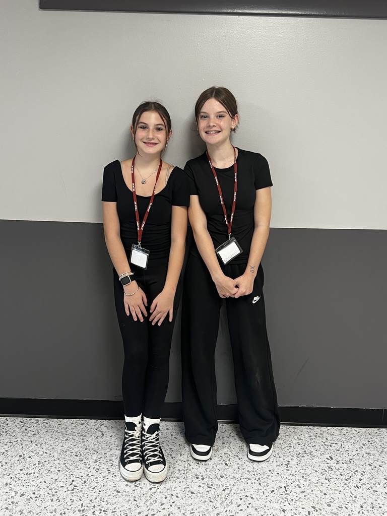 2 students wearing all black