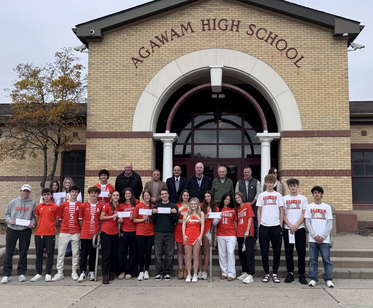student athletes and elected officials outside Agawam high school