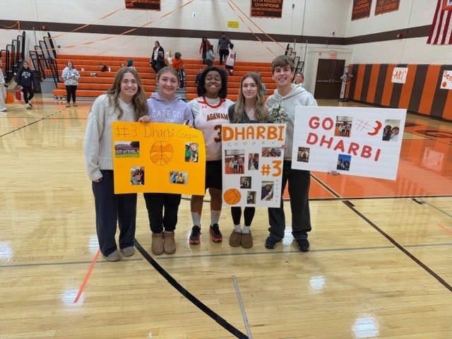 Senior basketball player and fans