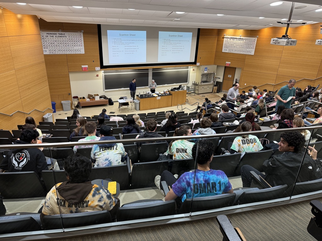 chem olympians taking the test in an auditorium