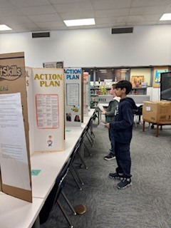 student reading civic project display