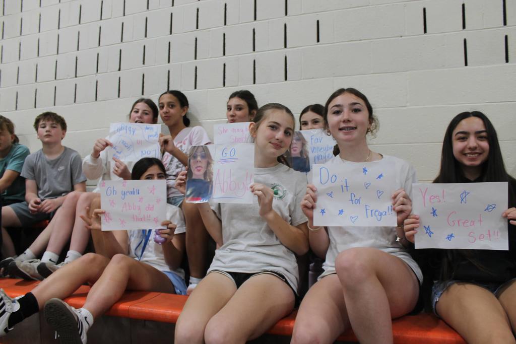 audience holding flyers 
