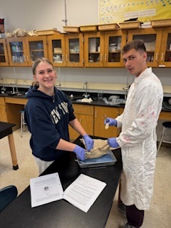 students sitting at science table
